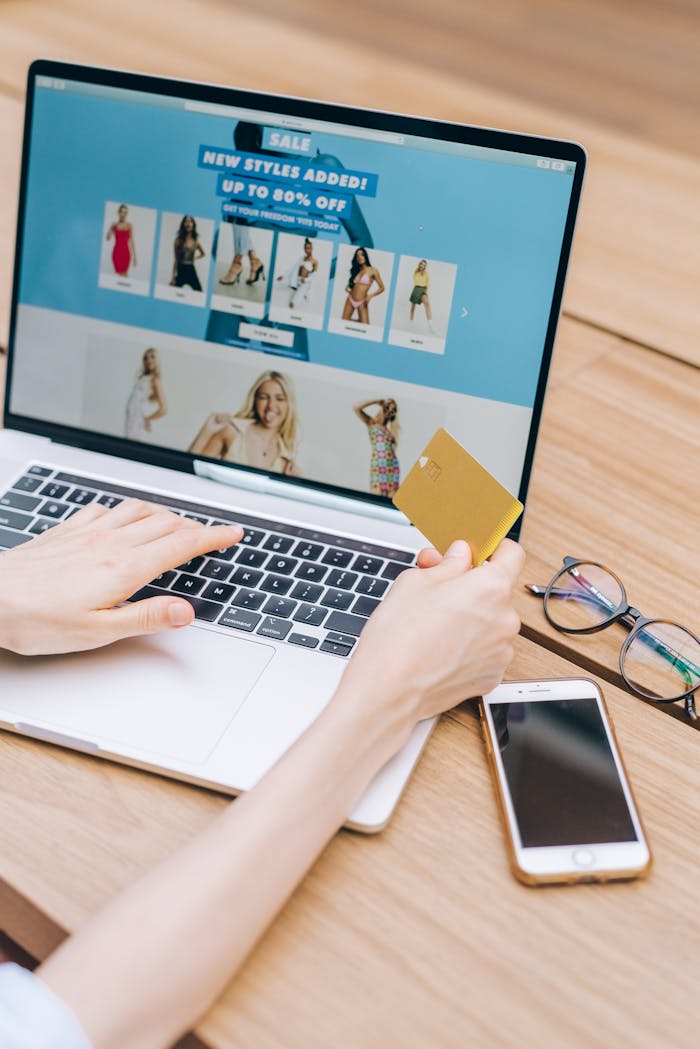 gallery-2 Person shopping online using a laptop and credit card, lifestyle technology concept.